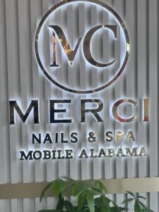merci nail & spa sign