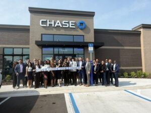 Group of people at Chase Bank grand opening in Atlantic North Shopping Center.