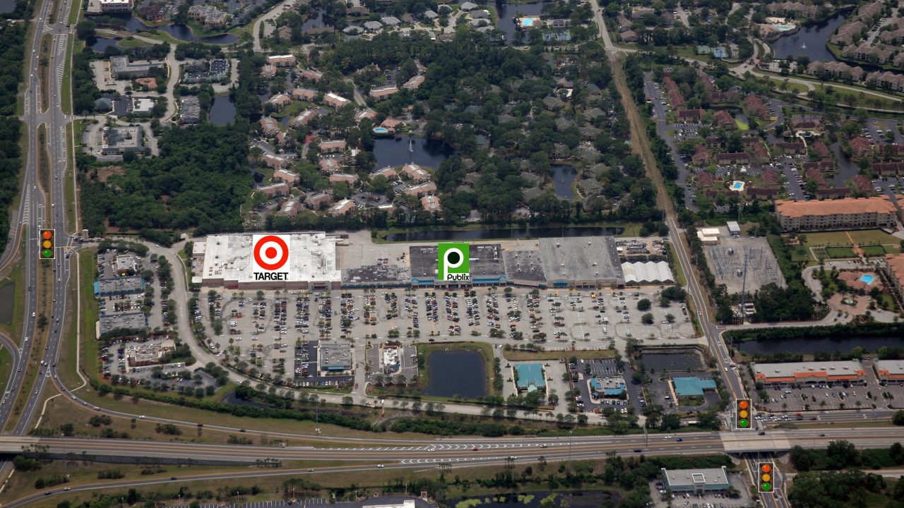 Aerial view of a shopping center with Target and parking lot.